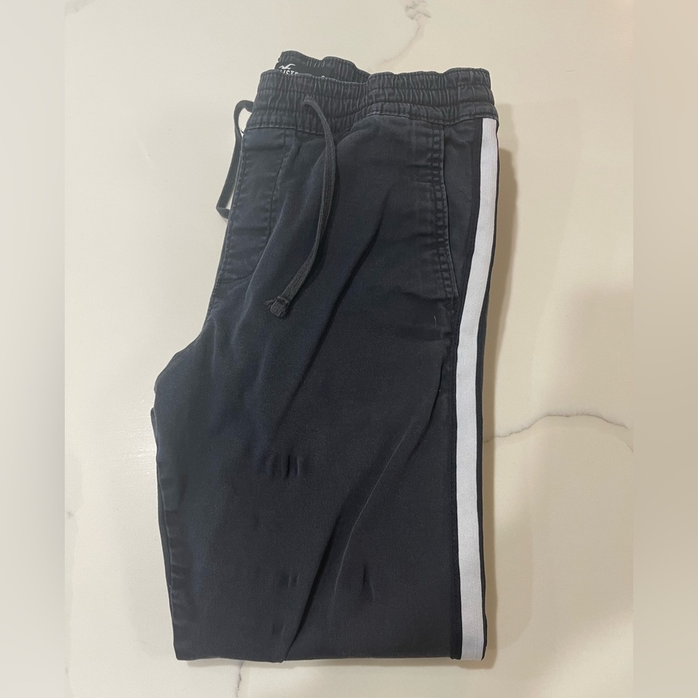 Black holister sweatpants with white stripe